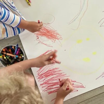 Child makes marks based on story of emotions