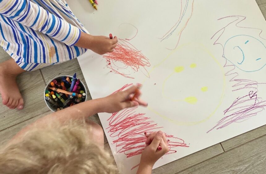 Child makes marks based on story of emotions