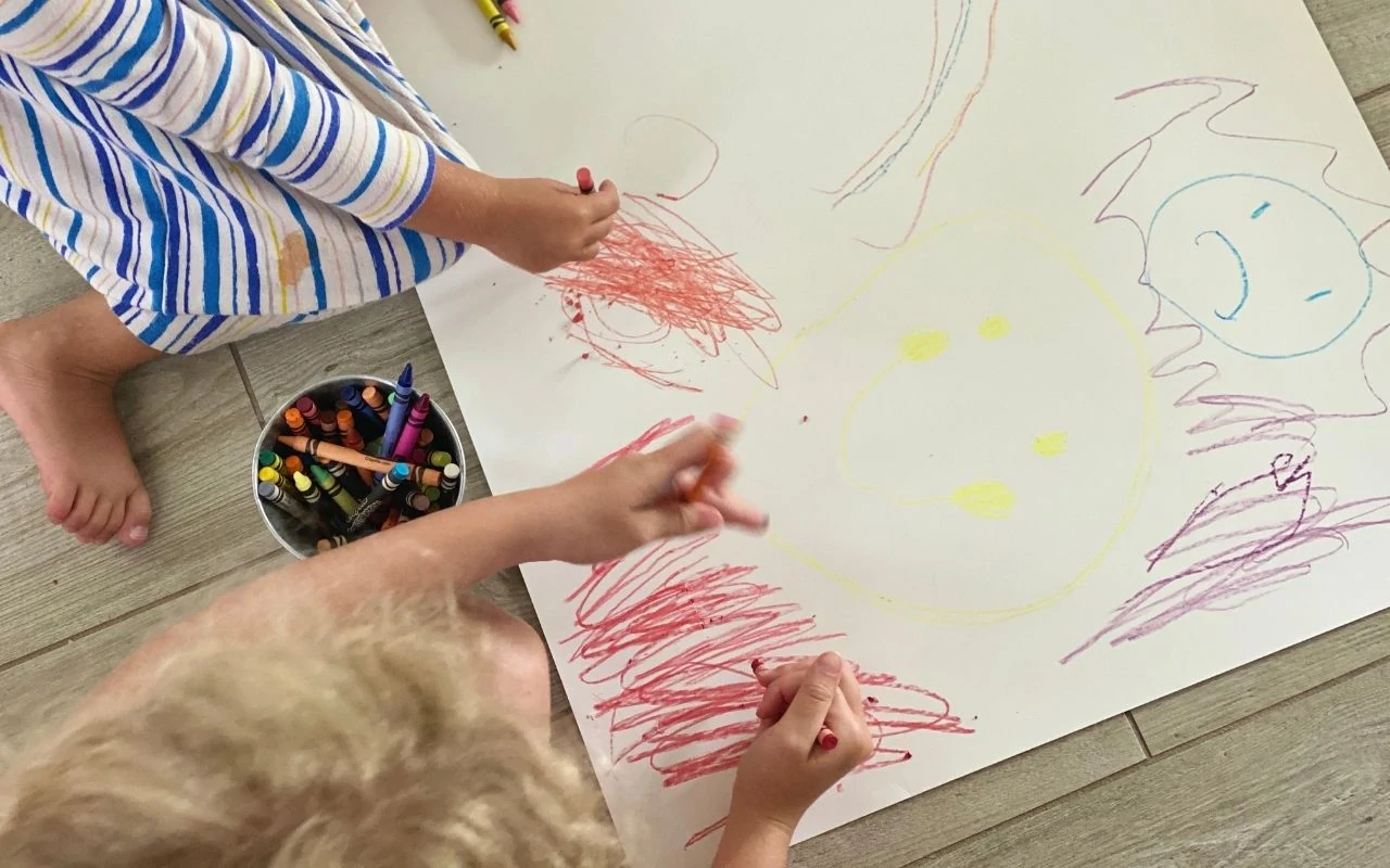 Child makes marks based on story of emotions