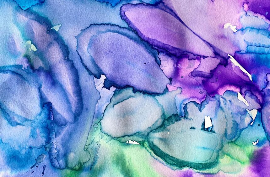 Children painting with liquid watercolor over leaves on paper.