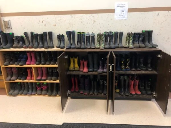rain boots on a boot shelf