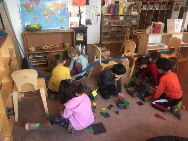 children playing with magnatiles
