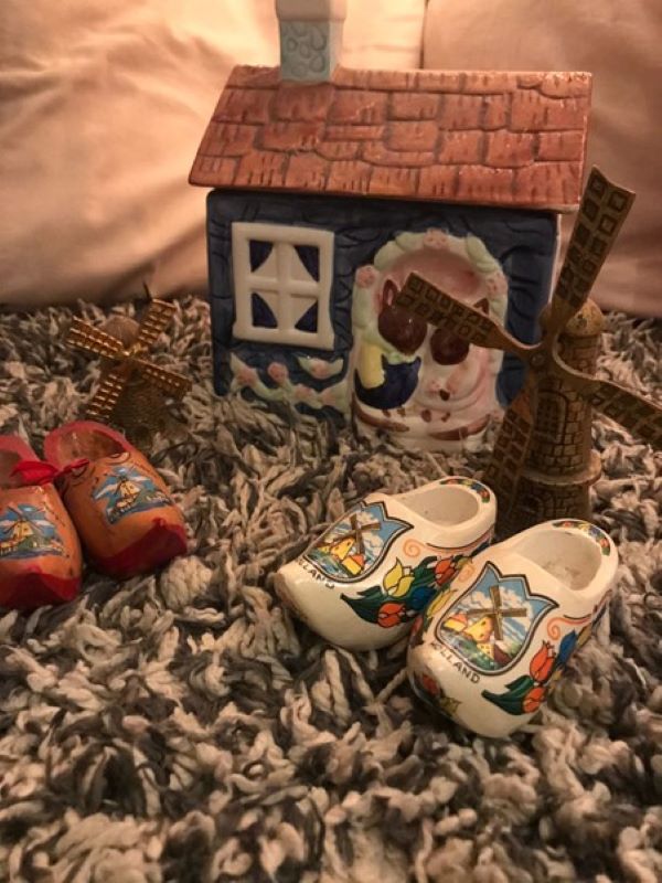 small wooden clogs with windmills on them