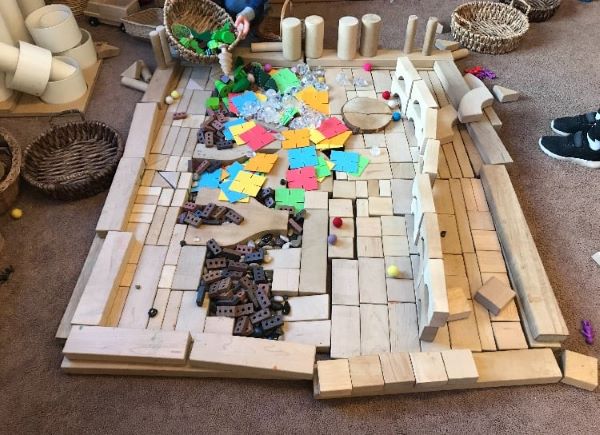 wooden blocks set out in a flat rectangle